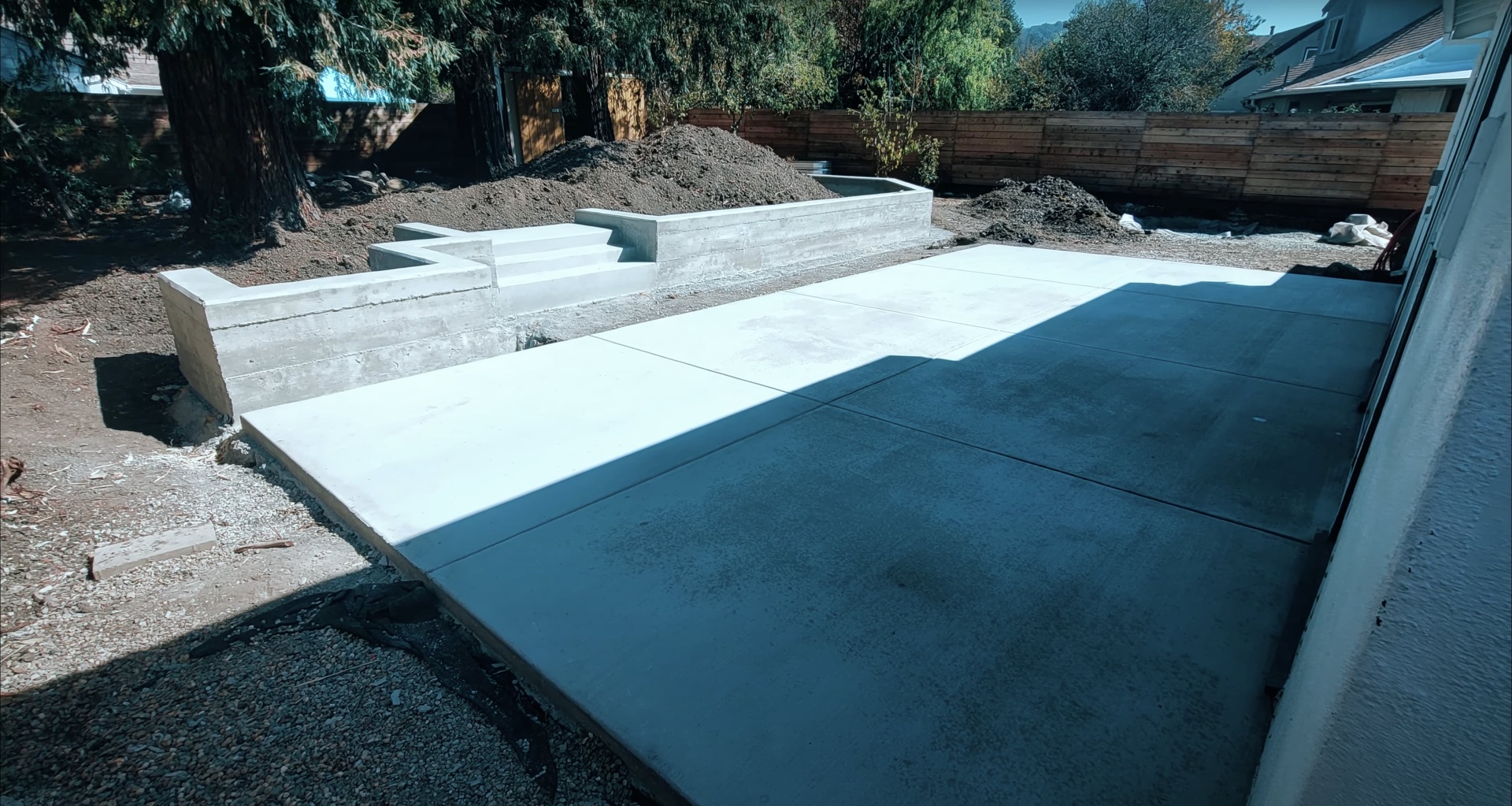 Modern concrete foundation and patio construction with clean lines