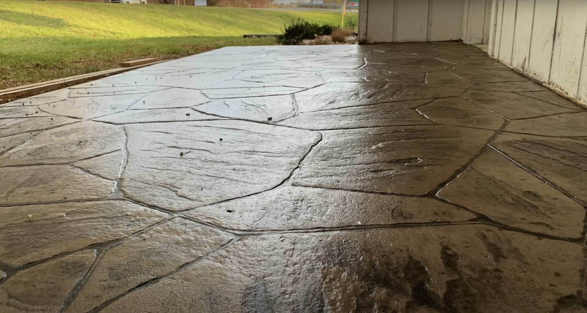 Concrete driveway showing wear and cracking before professional repair