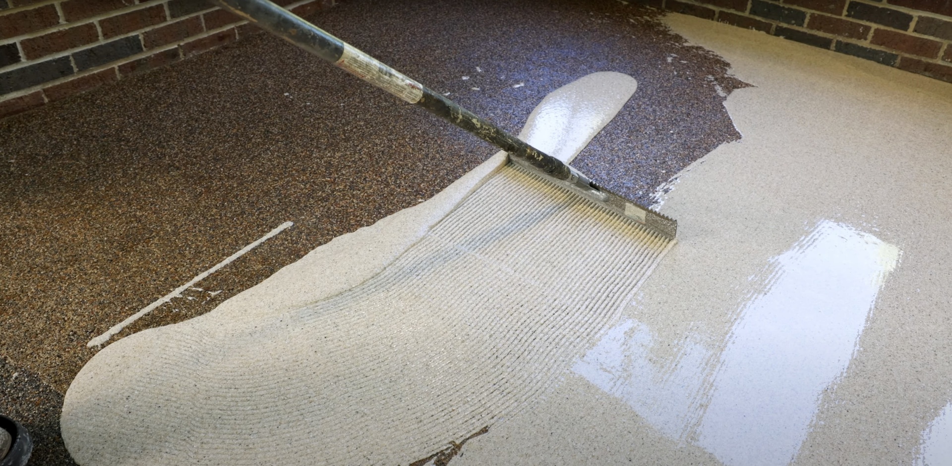 Professional concrete finishing work showing smooth surface application