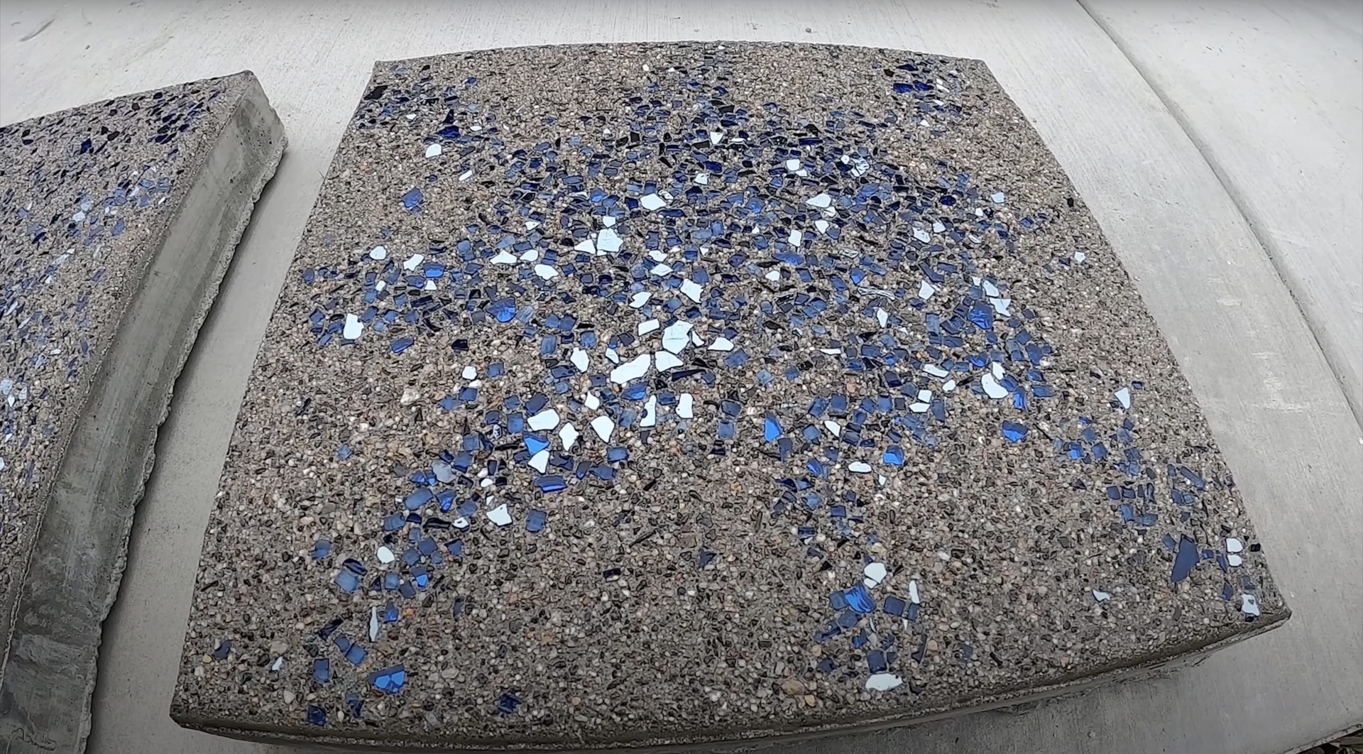 Decorative concrete surface with blue and white glass aggregate finish