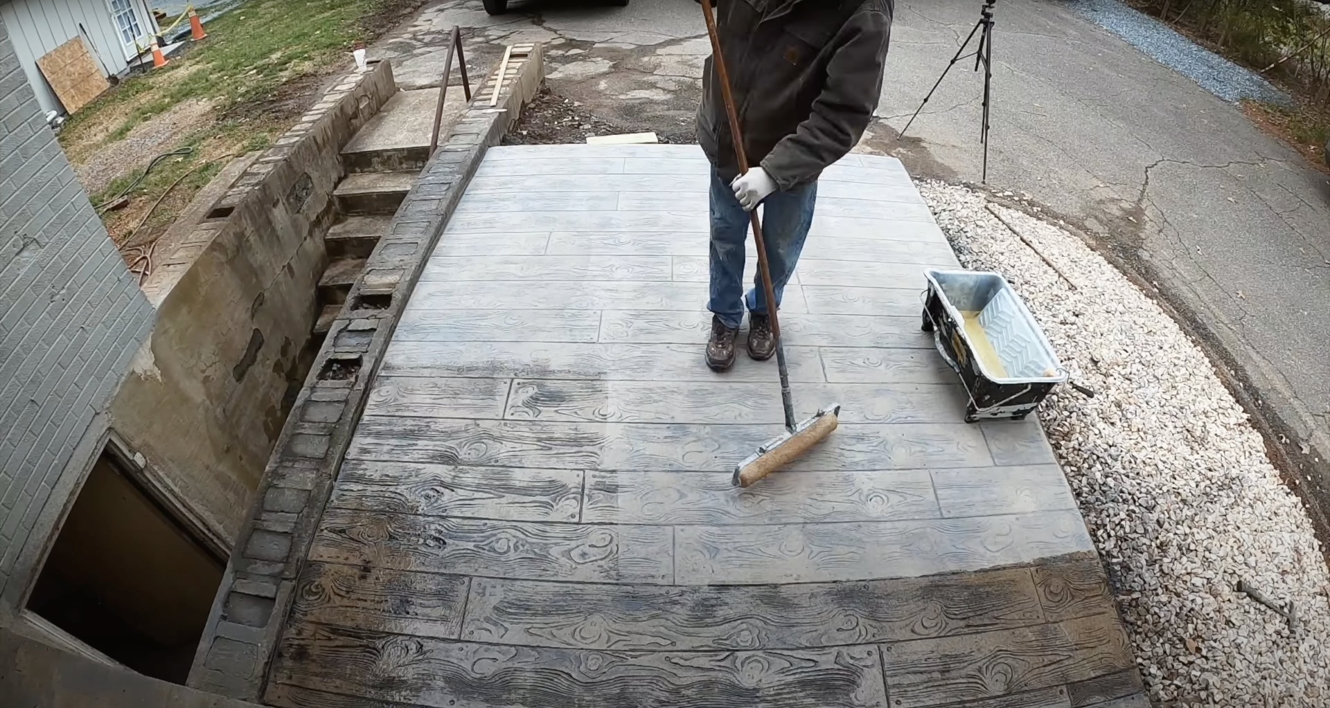 Concrete contractor working on stamped concrete patio installation