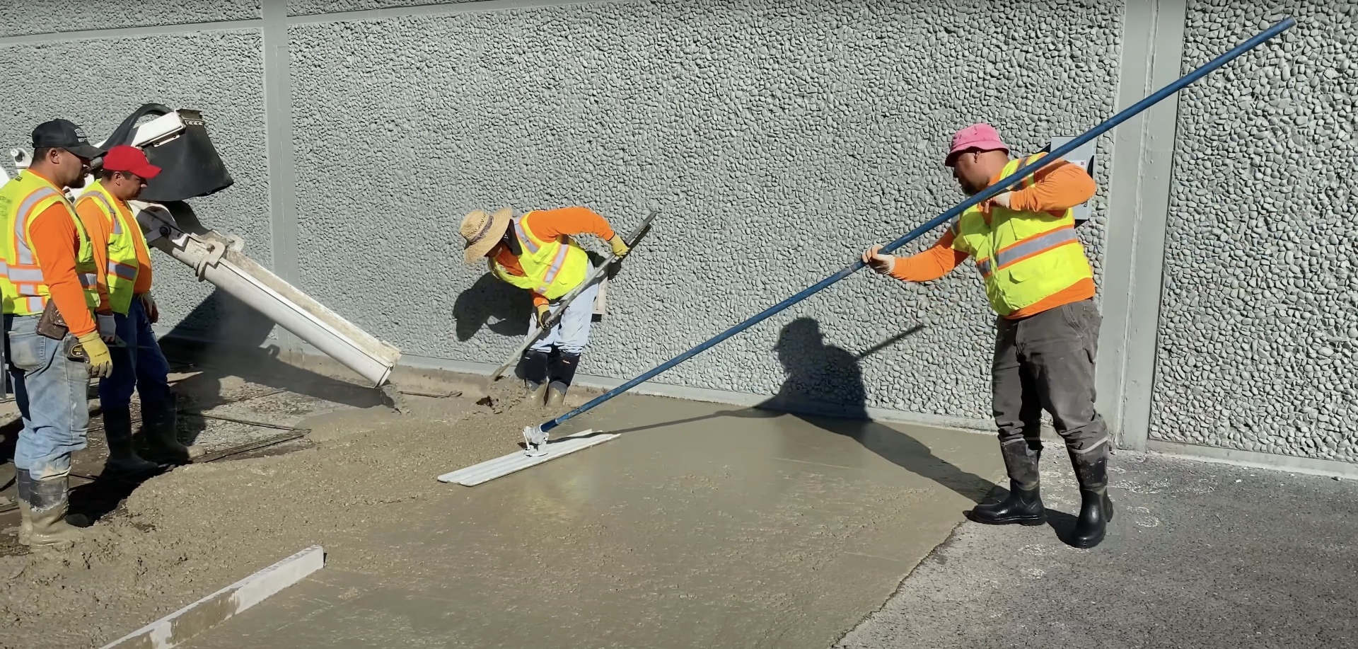 Professional concrete contractors working on a large concrete foundation project